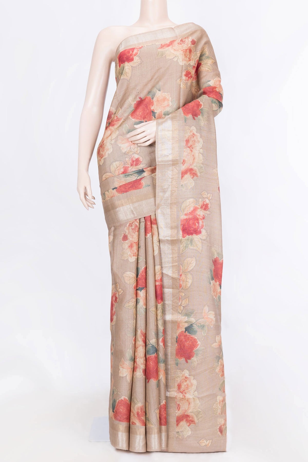 Beige Dual Tone Tussar Silk Saree with Printed design on the body and Zari Border displayed on a mannequin