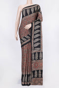 Brown Dual Tone Linen Saree with Printed design on the body and Zari Border displayed on a mannequin