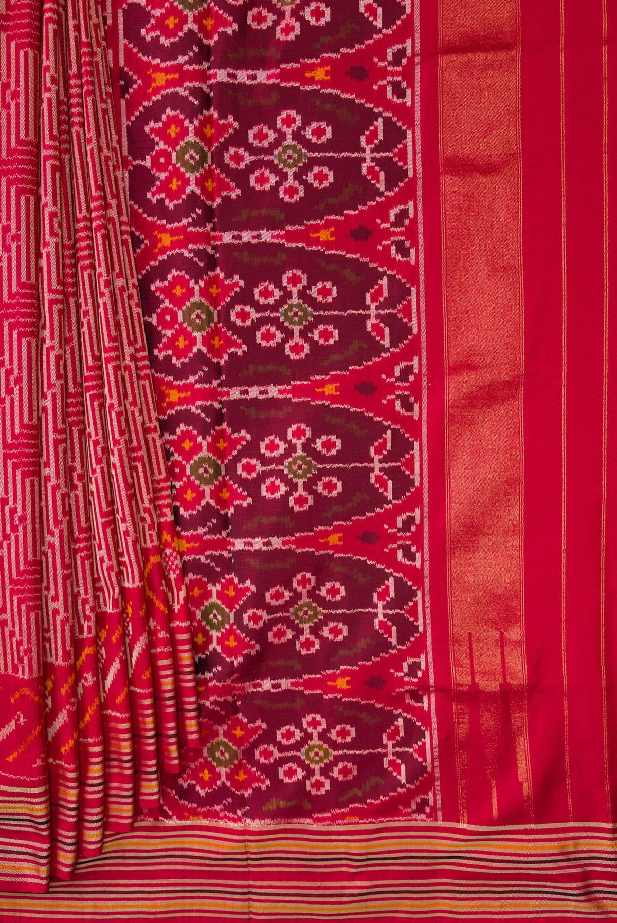 Pleats and pallu of Maroon Dual Tone Double Ikat Saree with Ikat Print on the body and Thread Border. 