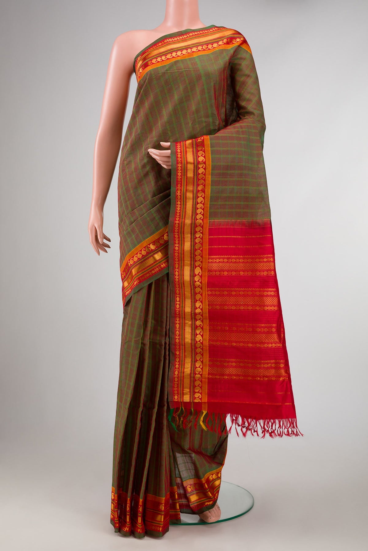Green Dual Tone Gadwal Silk Saree with Checked design on the body and Zari Border displayed on a mannequin