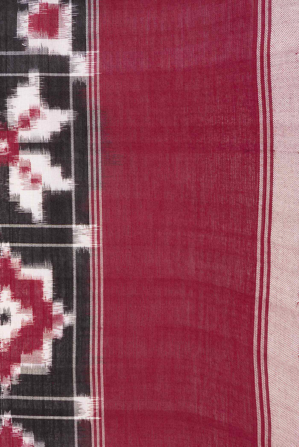 Border image of Black Dual Tone Double Ikat Saree with Ikat Print on the body and Plain Border