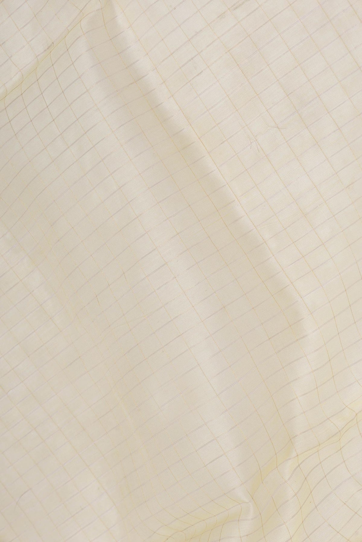Close up of Sandal Dual Tone Chanderi Silk Saree with Checked design on the body and Zari Border displaying folds