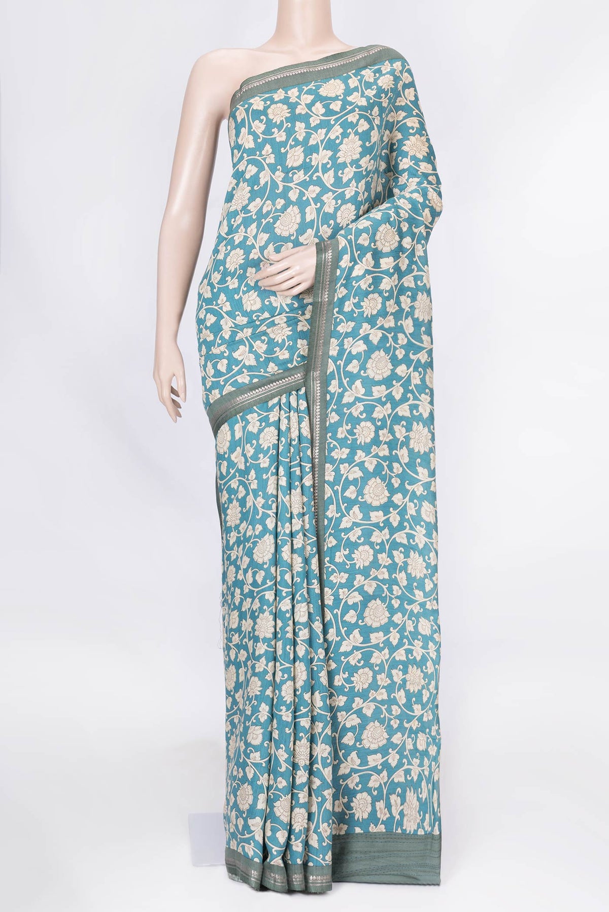 Blue Dual Tone Tussar Saree with Printed design on the body and Zari Border displayed on a mannequin