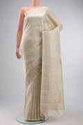 Cream Kanchipuram Silk Saree with Thread Butta on the body and Thread Border displayed on a mannequin