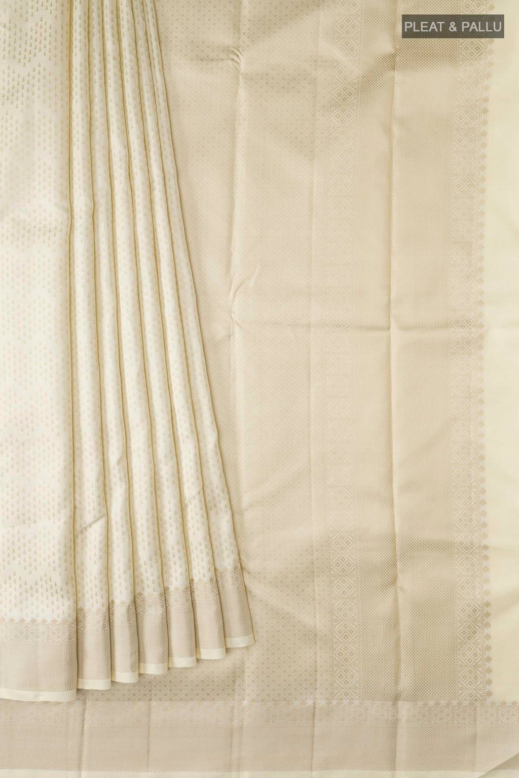 Pleats and pallu of Cream Kanchipuram Silk Saree with Thread Butta on the body and Thread Border