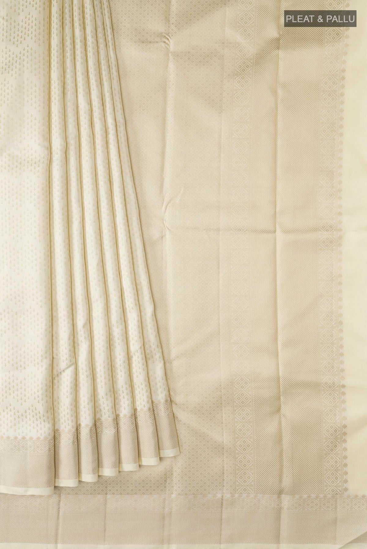 Pleats and pallu of Cream Kanchipuram Silk Saree with Thread Butta on the body and Thread Border