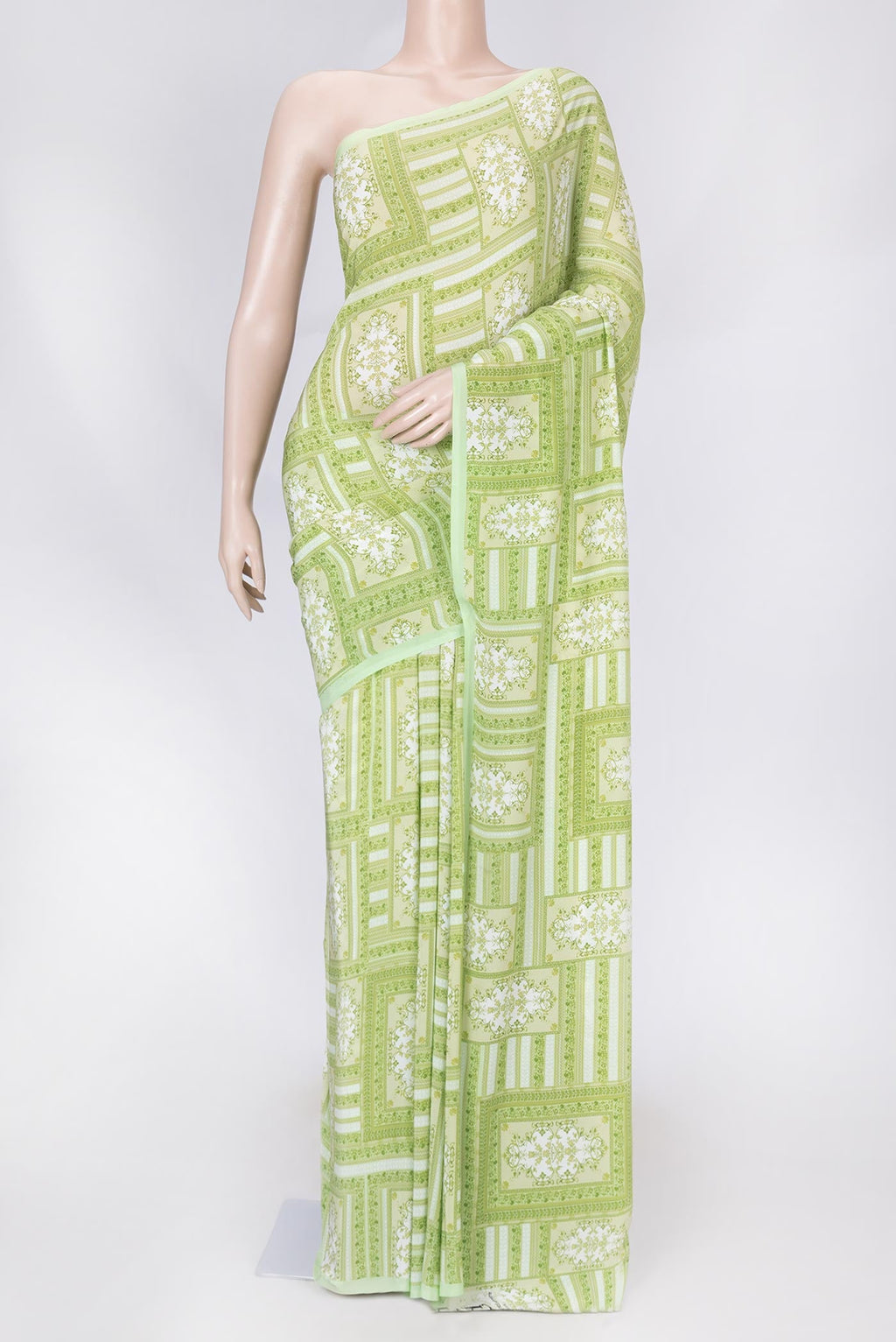 Pista Green Dual Tone Mysore Crepe Saree with Printed design on the body and Printed Border displayed on a mannequin