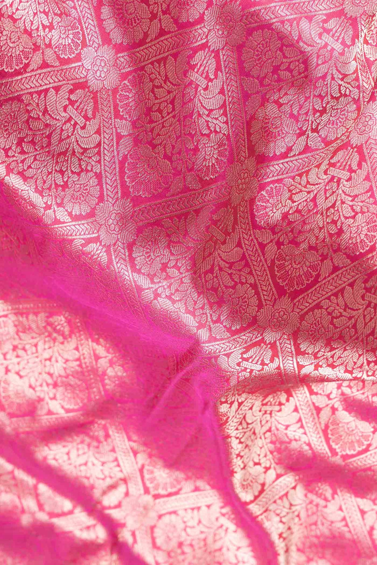 Close up of Pink Dual Tone Banarasi Silk Saree with Zari Brocade on the body and Zari Border.  displaying folds