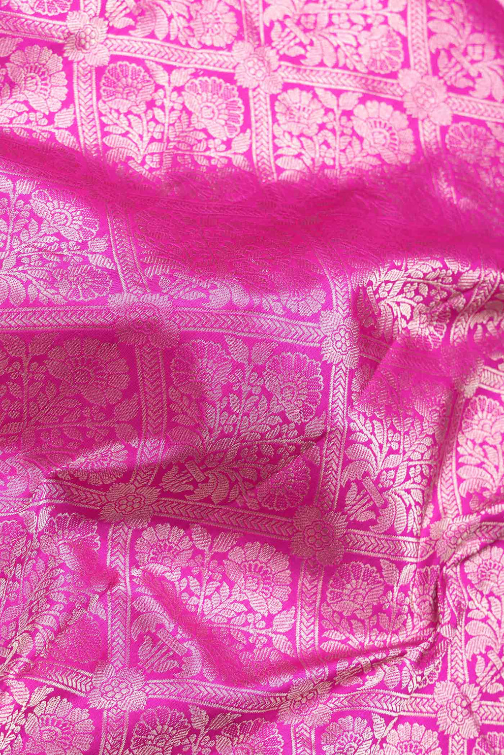 Close up of Dark Pink Dual Tone Banarasi Silk Saree with Zari Brocade on the body and Zari Border.  displaying folds