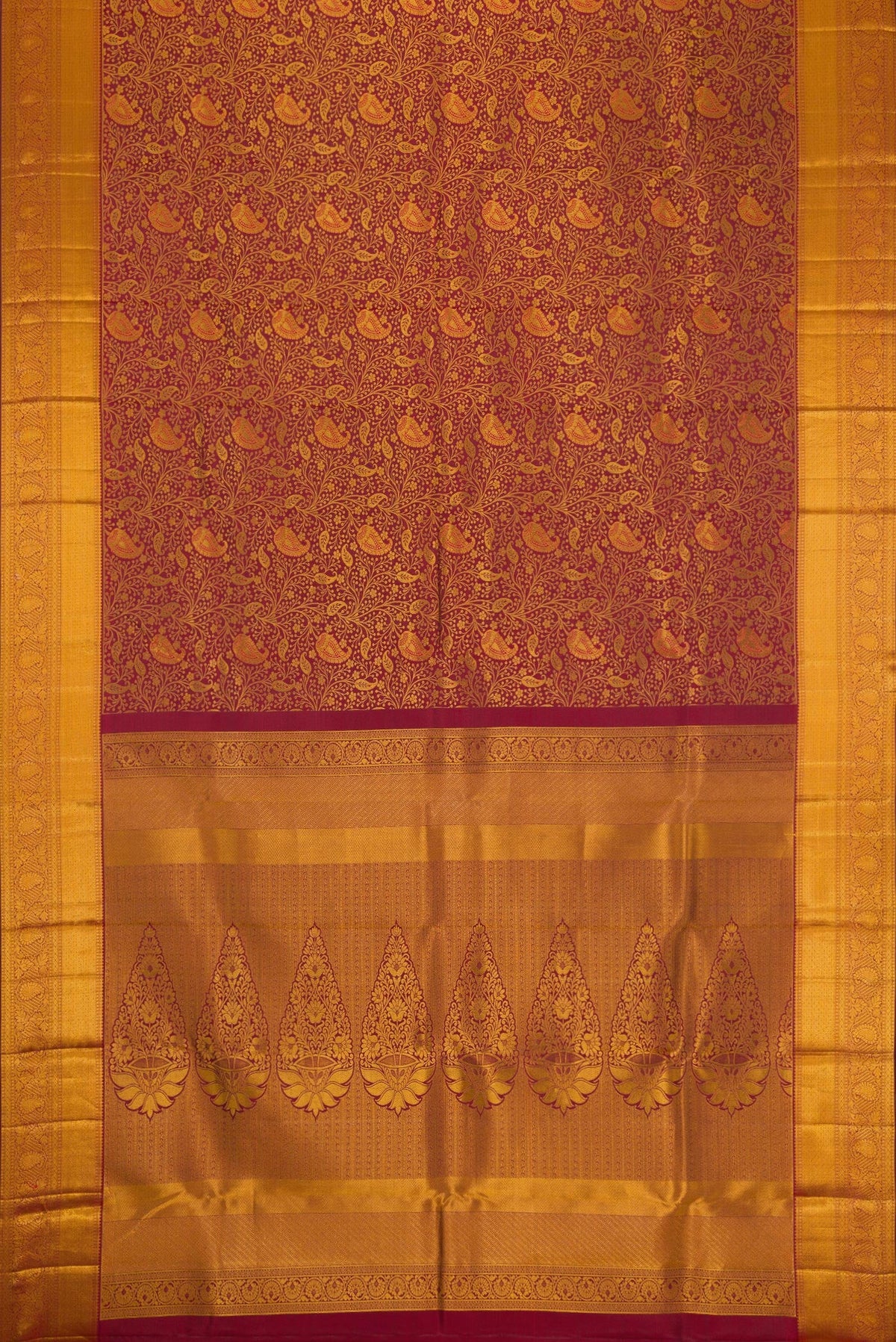 Flat view of Maroon Dual Tone Kanjivaram Silk Saree with Zari Brocade on the body and Zari Border. 