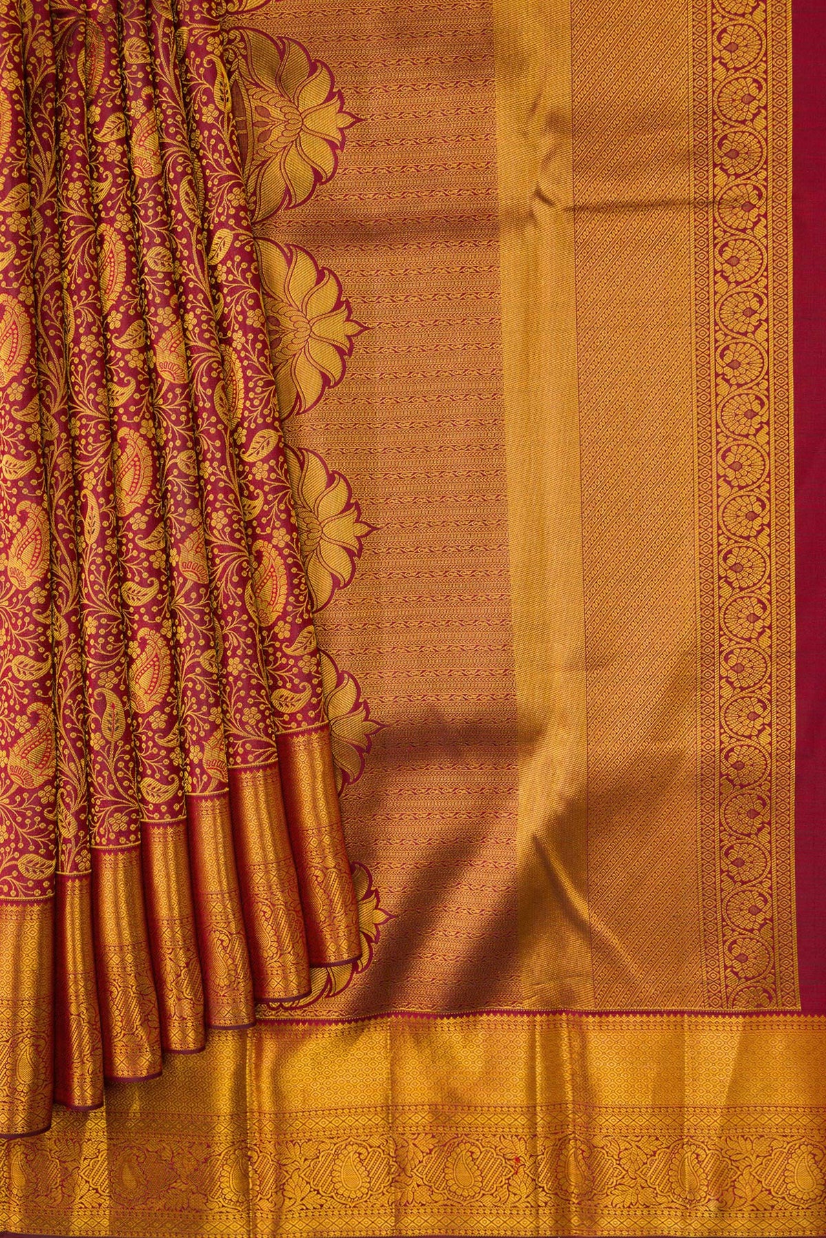 Pleats and pallu of Maroon Dual Tone Kanjivaram Silk Saree with Zari Brocade on the body and Zari Border. 