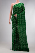 Bottle Green Dual Tone Bandhani Silk Saree with Printed design on the body and Printed Border.  displayed on a mannequin