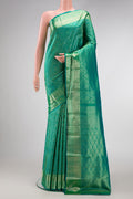 Green Dual Tone Kanchipuram Silk Saree with Zari Brocade on the body and Zari Border.  displayed on a mannequin