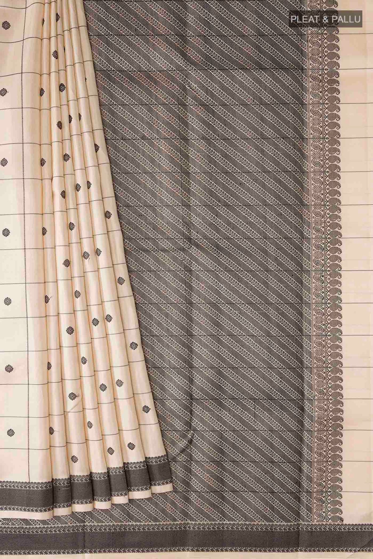 Pleats and pallu of Sandal Kanchipuram Silk Saree with Checked design on the body and Thread Border