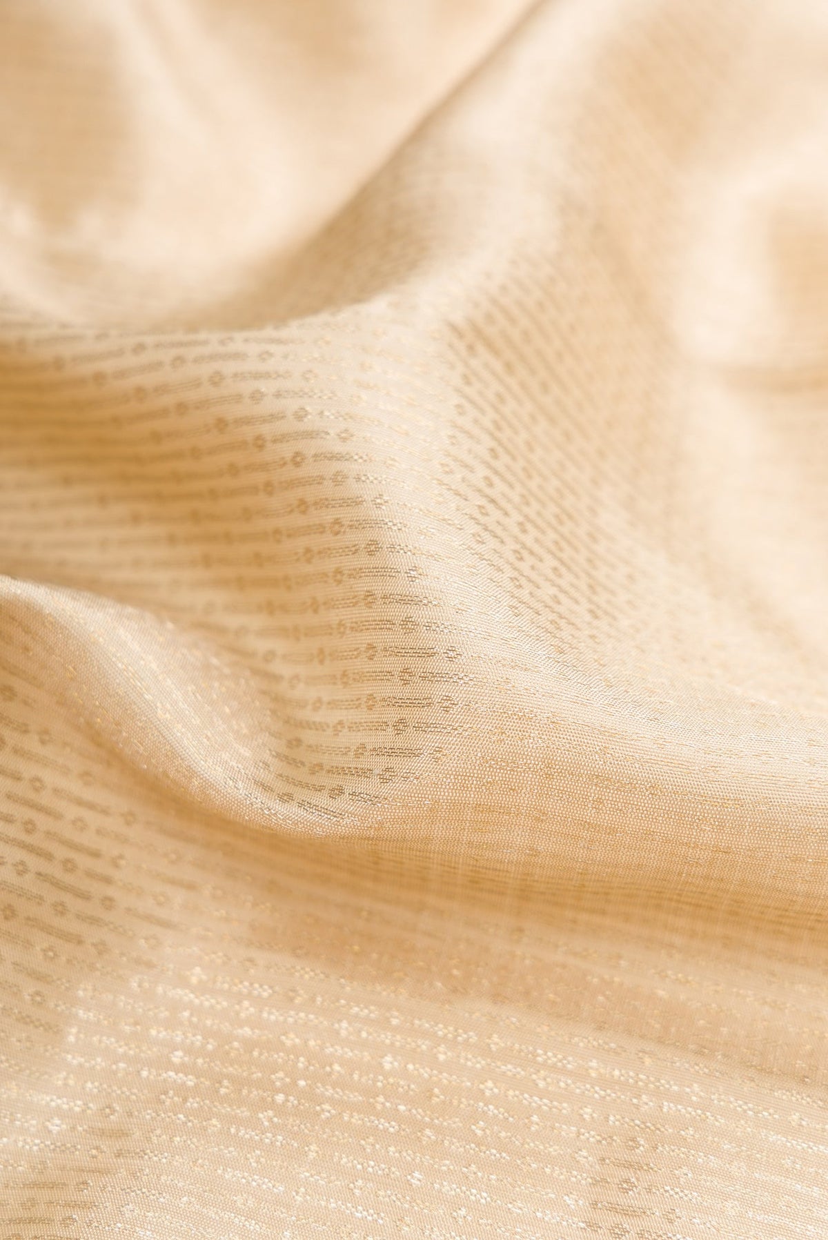 Close up of Pista Green Dual Tone Kanchipuram Silk Saree with Zari Brocade on the body and Zari Border.  displaying folds