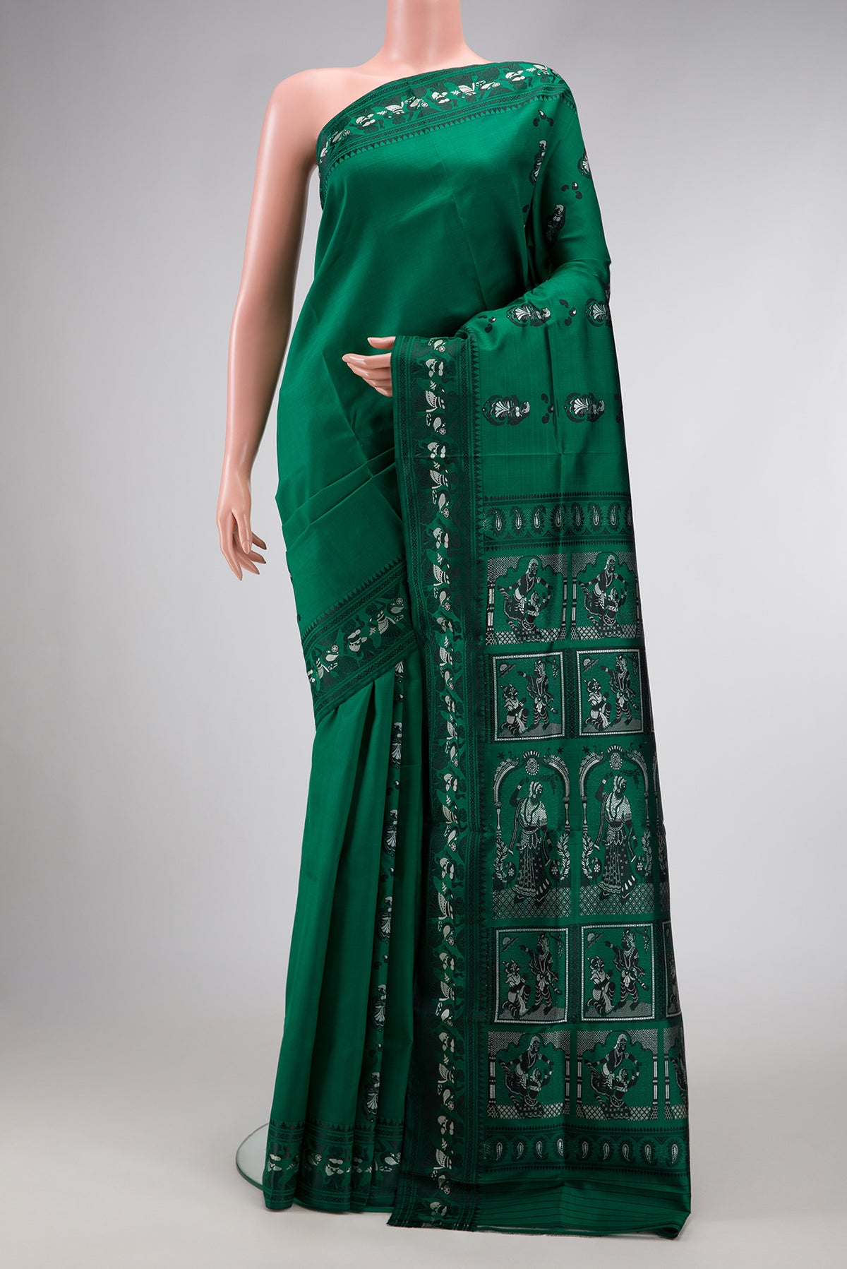 Bottle Green Baluchari Silk Saree with Thread Butta on the body and Thread Border.  displayed on a mannequin