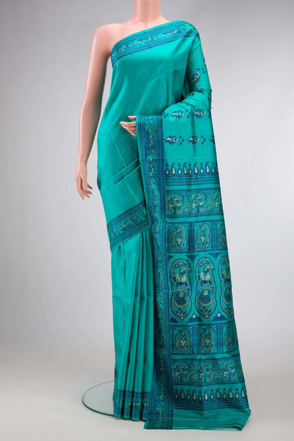 Turquoise Baluchari Silk Saree with Thread Butta on the body and Thread Border.  displayed on a mannequin