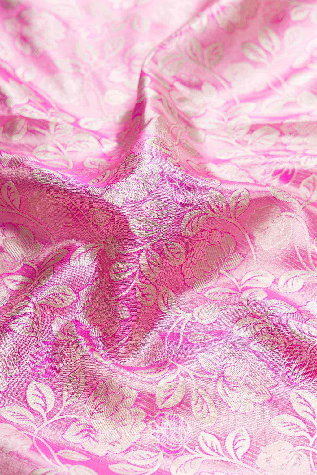 Close up of Pink Dual Tone Kanchipuram Tissue Silk Saree with Zari Brocade on the body and Zari Border displaying folds