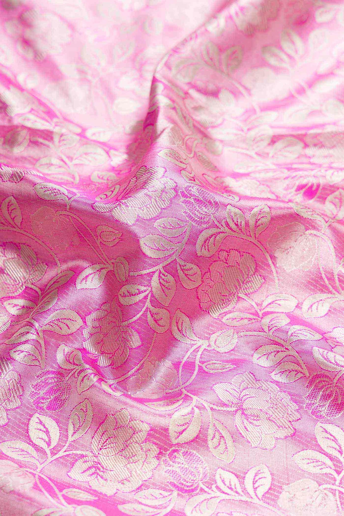 Close up of Pink Dual Tone Kanchipuram Tissue Silk Saree with Zari Brocade on the body and Zari Border displaying folds