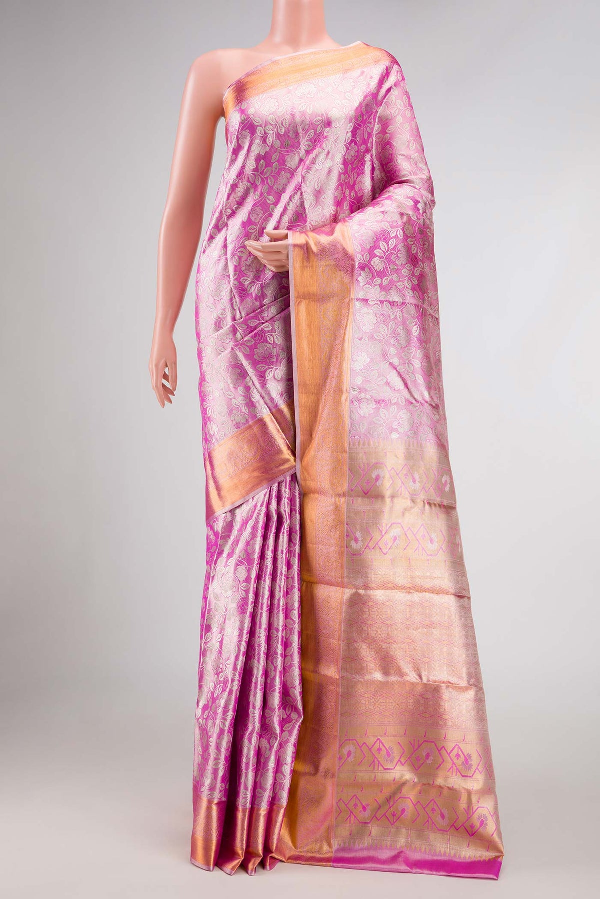 Pink Dual Tone Kanchipuram Tissue Silk Saree with Zari Brocade on the body and Zari Border displayed on a mannequin