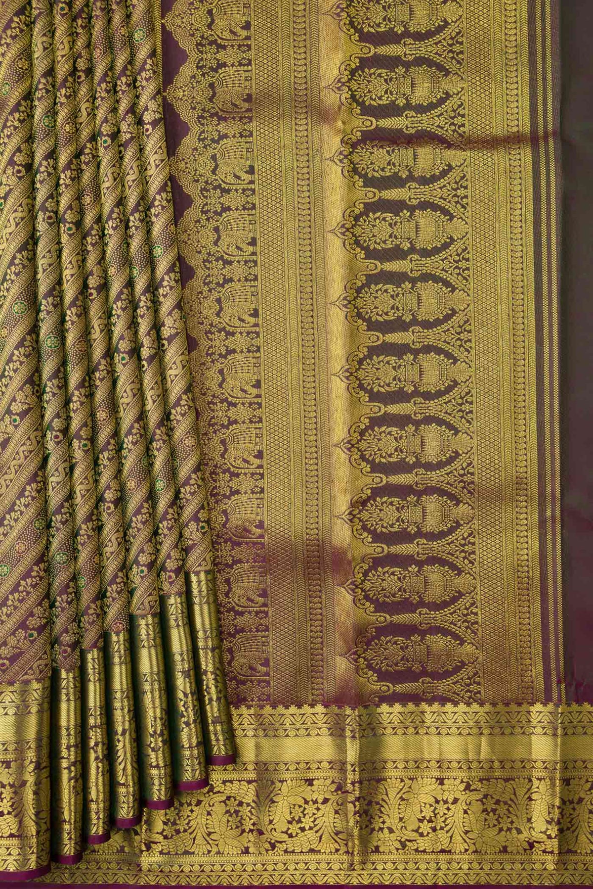 Pleats and pallu of Burgundy Dual Tone Kanchipuram Silk Saree with Zari Brocade on the body and Zari Border
