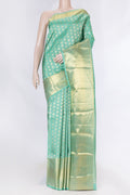 Sea Green Dual Tone Kanchipuram Saree with Zari Butta on the body and Zari Border displayed on a mannequin