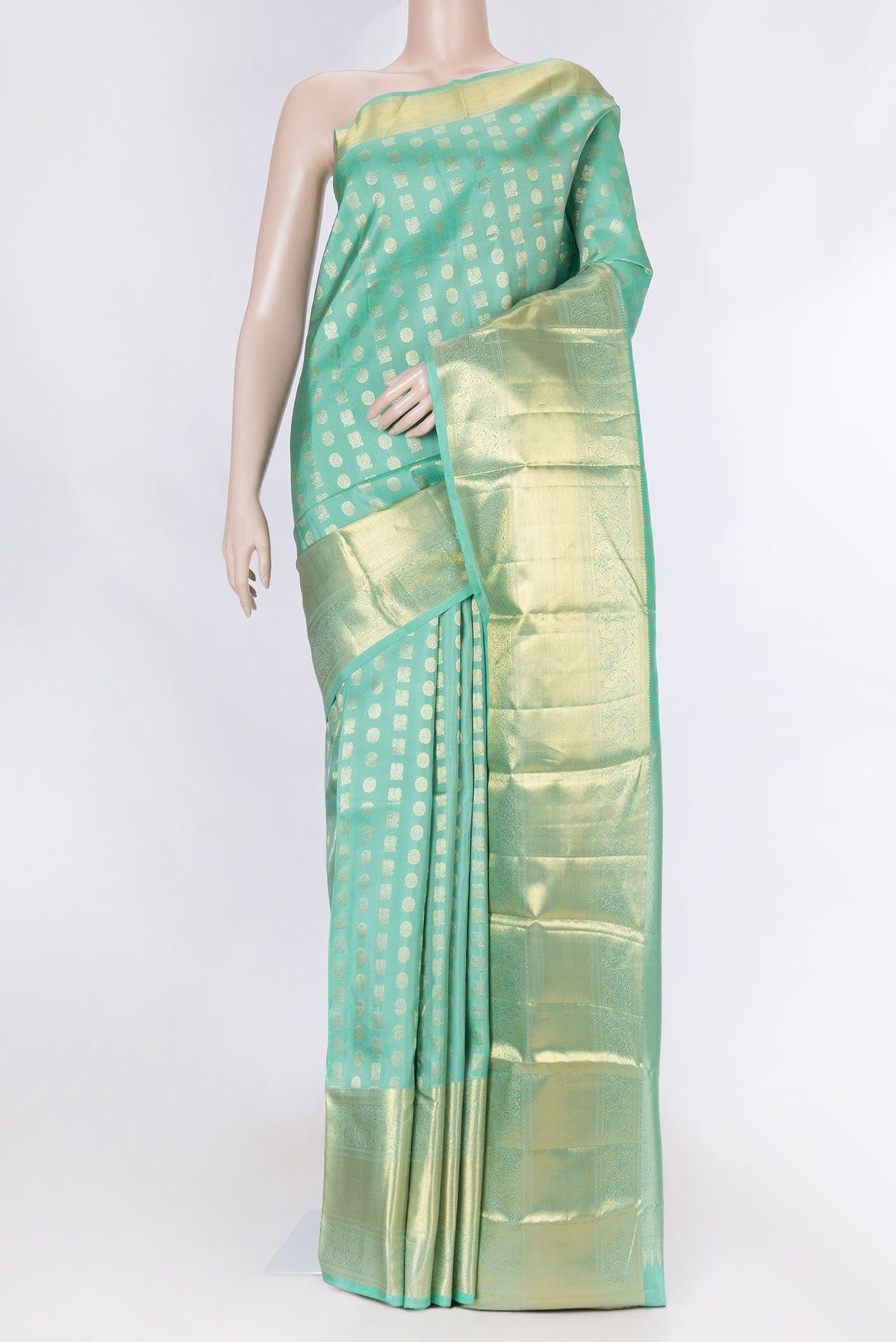 Sea Green Dual Tone Kanchipuram Saree with Zari Butta on the body and Zari Border displayed on a mannequin
