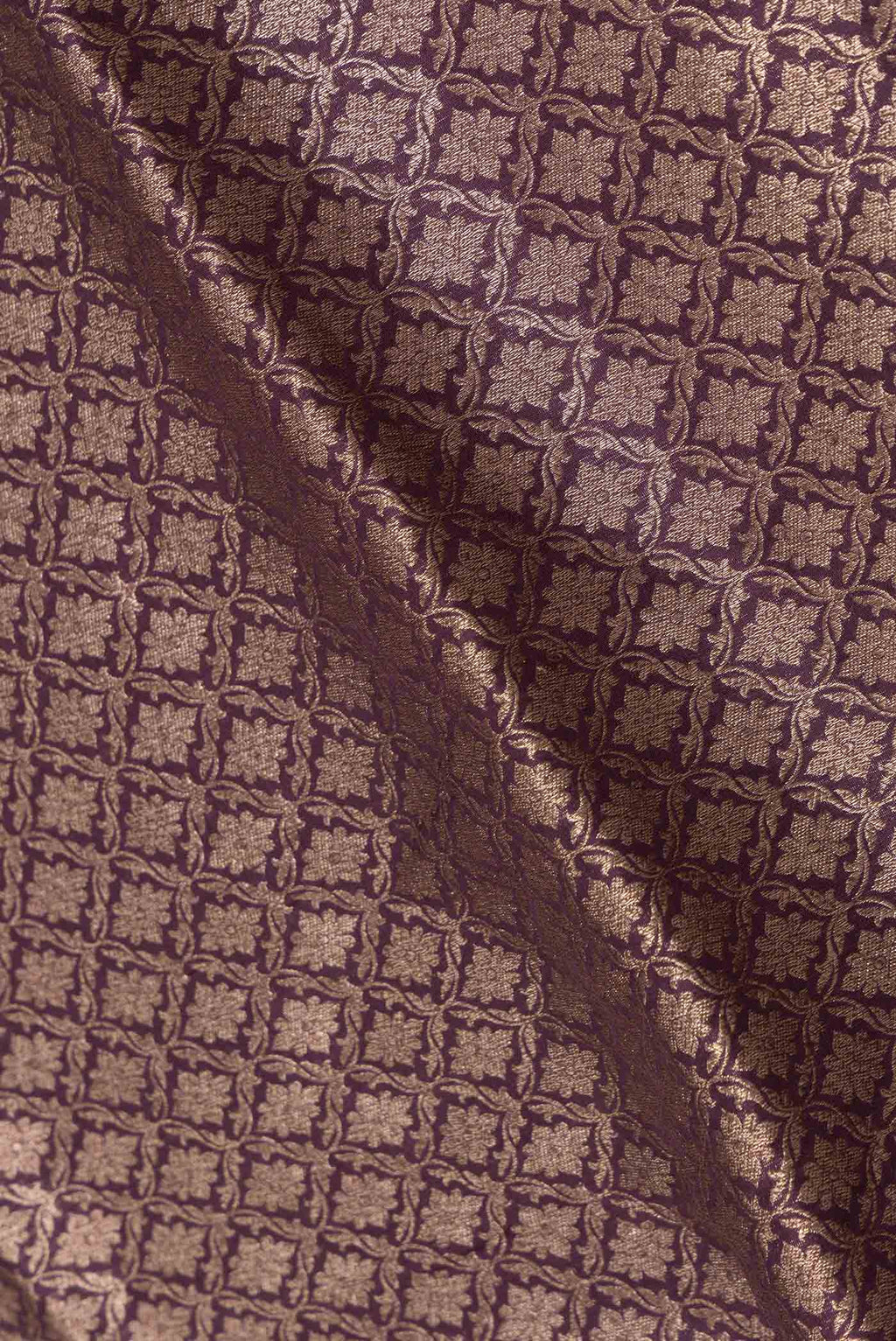 Close up of Burgundy Dual Tone Banarasi Silk Saree with Zari Brocade on the body and Zari Border displaying folds