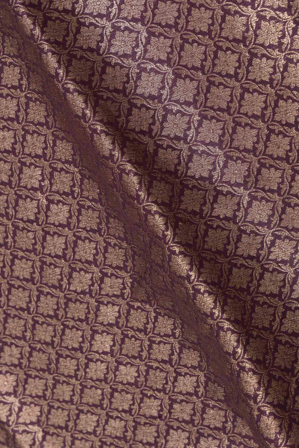 Close up of Burgundy Dual Tone Banarasi Silk Saree with Zari Brocade on the body and Zari Border displaying folds