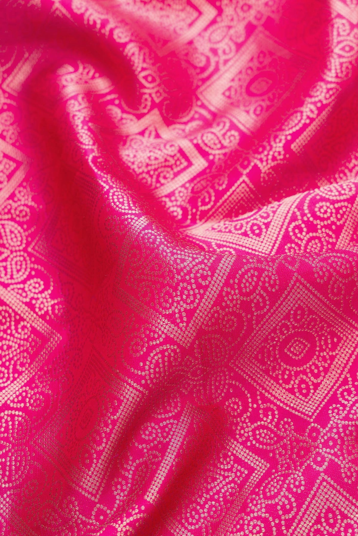 Close up of Pink Dual Tone Kanjivaram Silk Saree with Zari Brocade on the body and Zari Border.  displaying folds