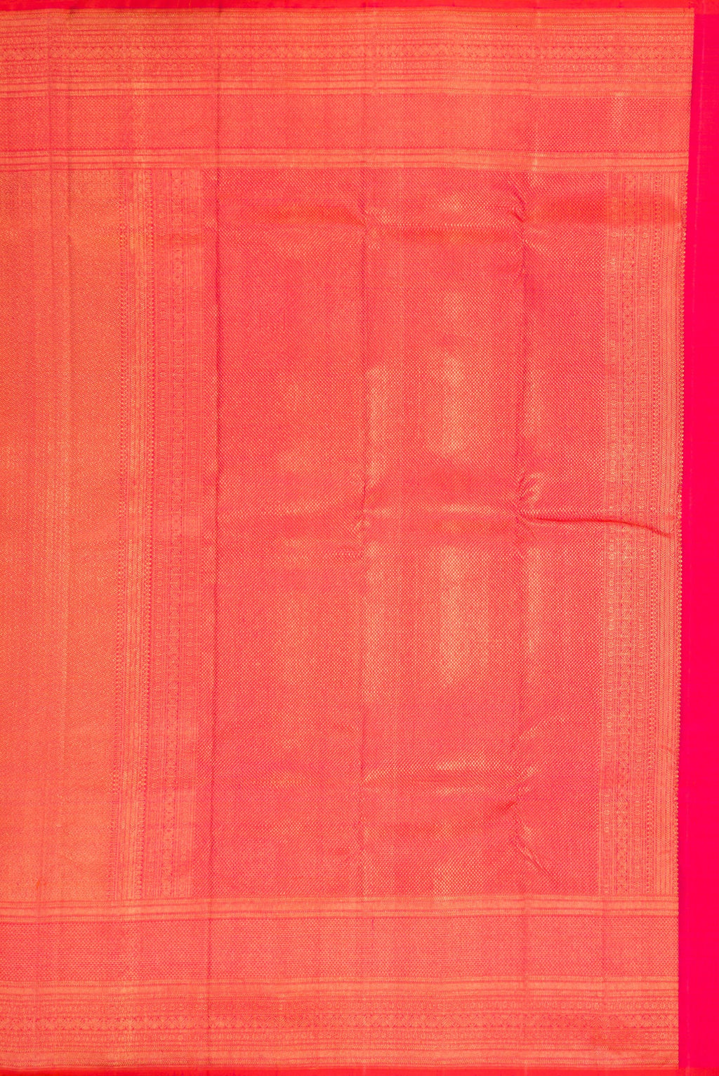 Close up image of the pallu of Coral Dual Tone Kanchipuram Silk Saree with Zari Brocade on the body and Zari Border. 