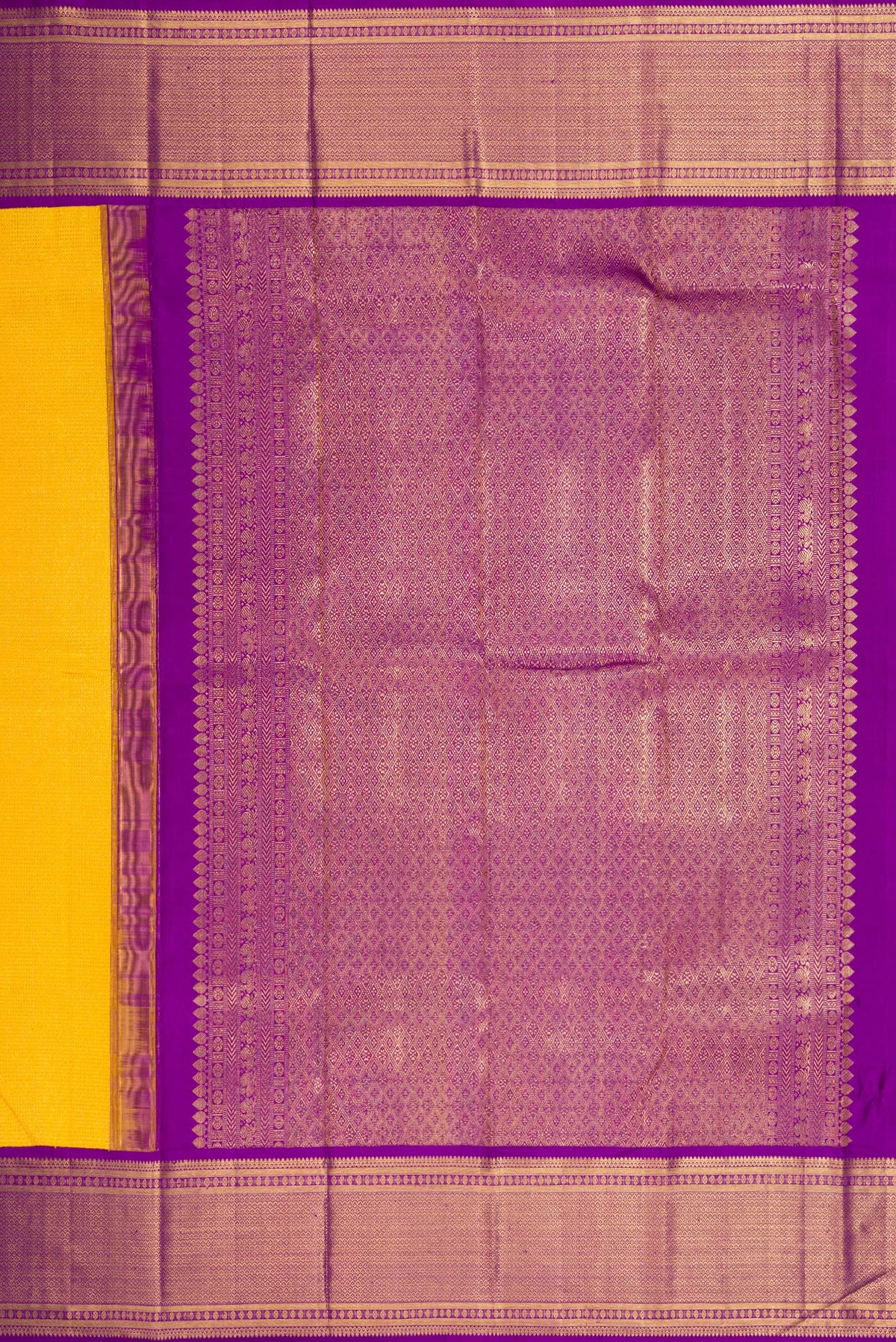 Close up image of the pallu of Yellow Dual Tone Kanchipuram Silk Saree with Zari Brocade on the body and Zari Border. 