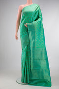 Sea Green Dual Tone Kanjivaram Silk Saree with Zari Brocade on the body and Zari Border.  displayed on a mannequin