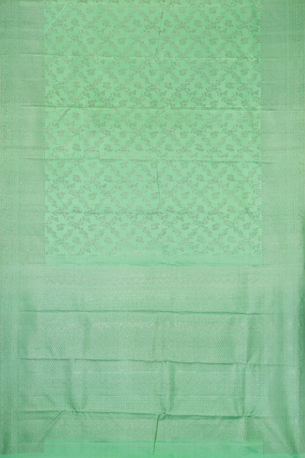 Flat view of Pista Green Dual Tone Kanjivaram Silk Saree with Zari Brocade on the body and Zari Border. 