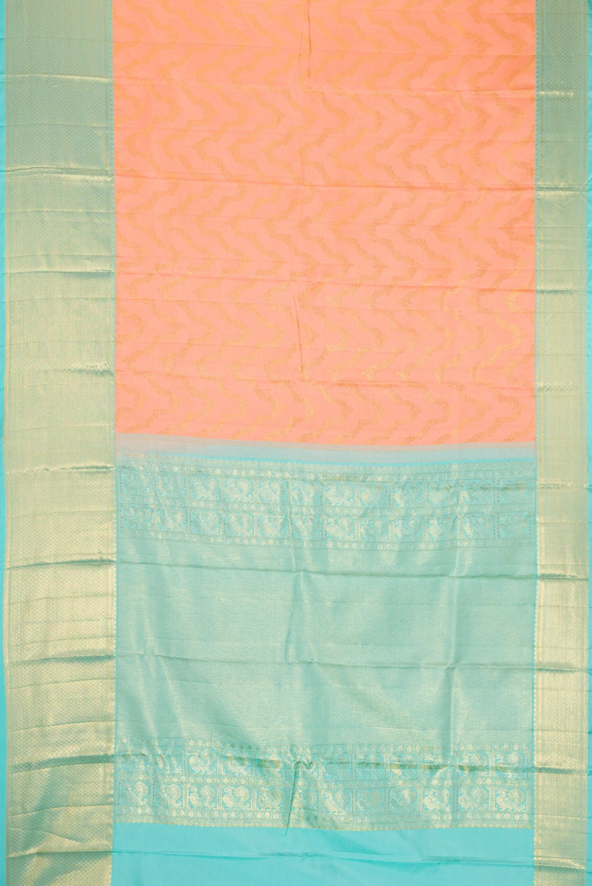 Flat view of Peach Dual Tone Kanjivaram Silk Saree with Zari Brocade on the body and Zari Border. 