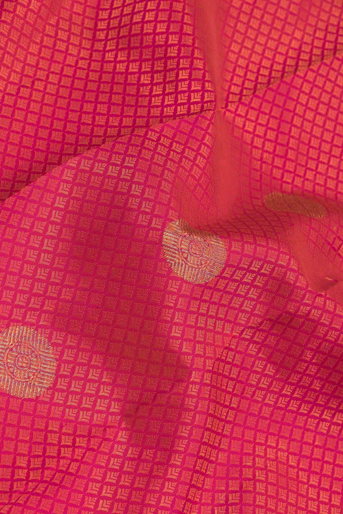 Close up of Pure Silk Pure Zari Pink Dual Tone Kanchipuram Saree with Jacquard With Zari Butta on the body and Zari Border displaying folds
