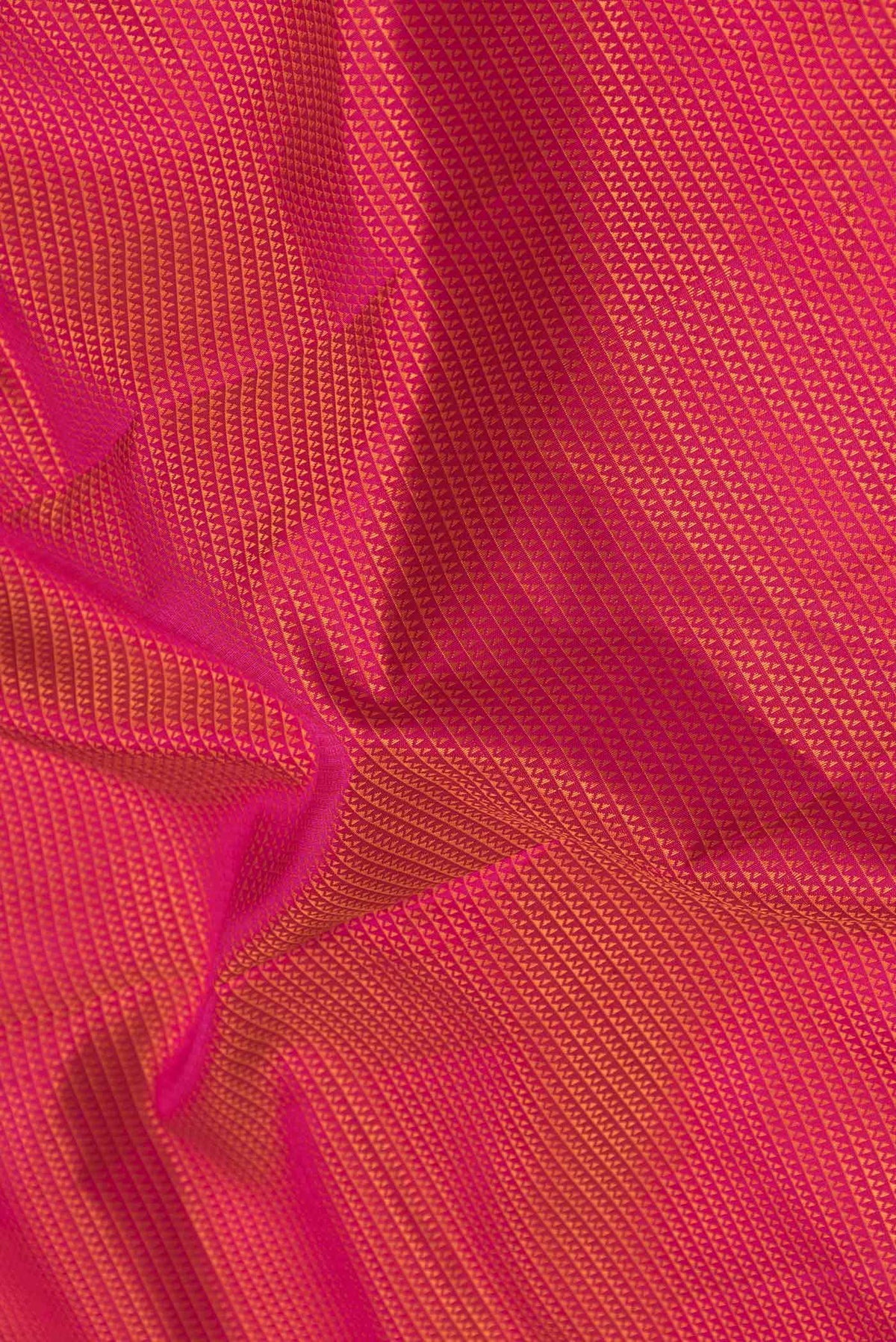 Close up of Pure Silk Pure Zari Pink Dual Tone Kanchipuram SareeJacquard design on the body and Zari Border displaying folds