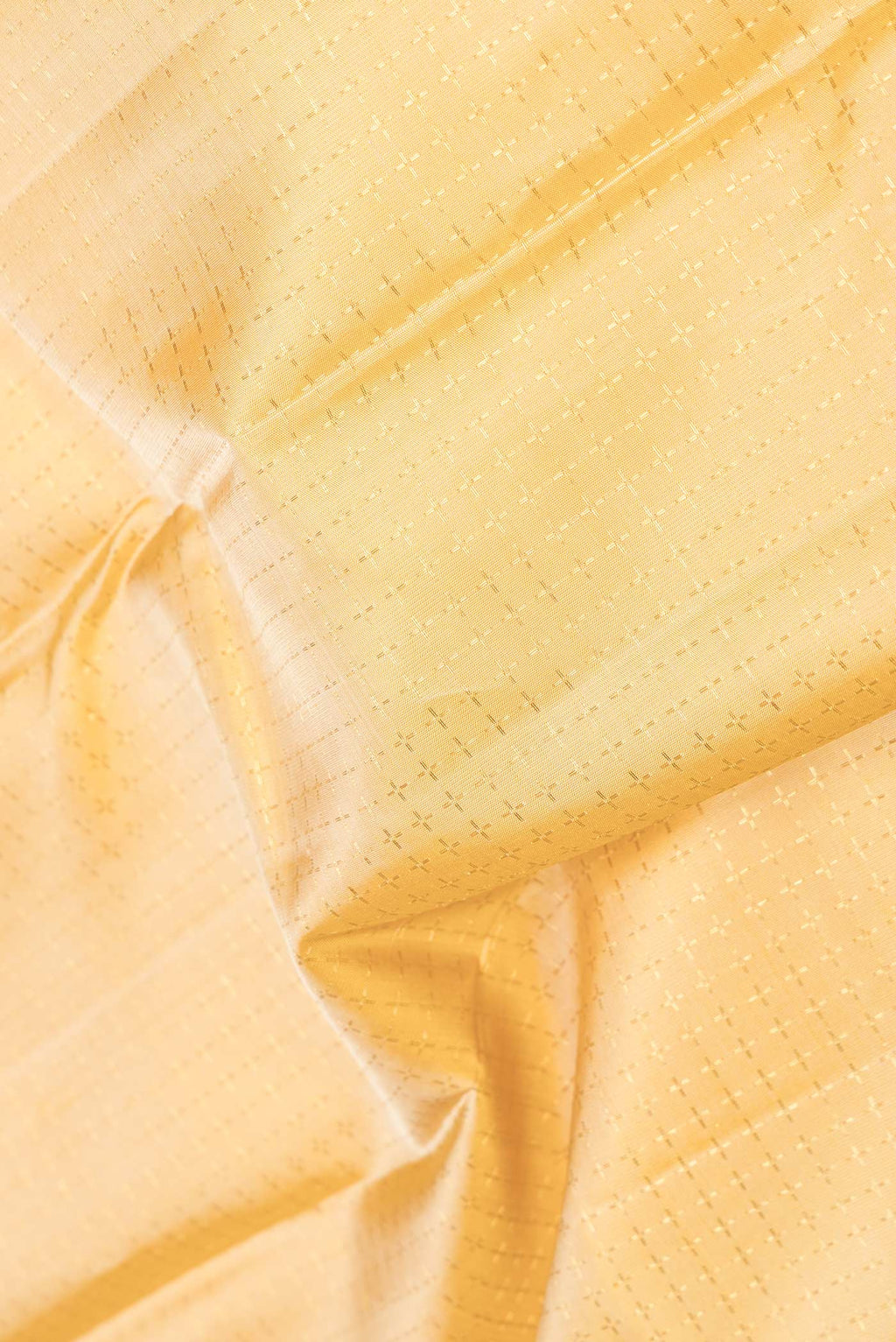 Close up of Pure Silk Pure Zari Sandal Dual Tone Kanchipuram Saree Checked design on the body and Zari Border displaying folds