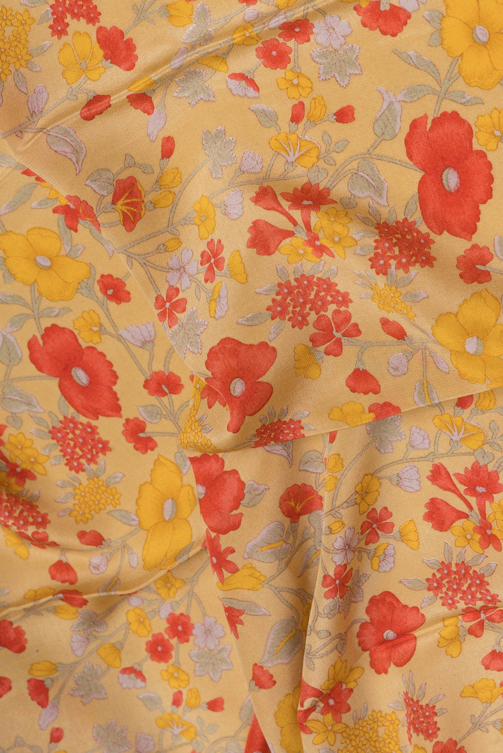 Close up of Sandal Crepe Saree with Floral Print on the body and Printed Border.  displaying folds