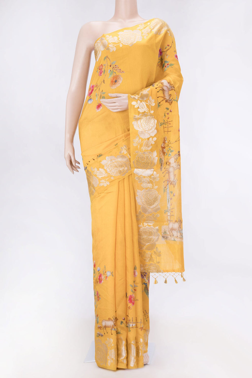 Orange Dual Tone Tussar Silk SareePrinted design on the body and Zari Border displayed on a mannequin