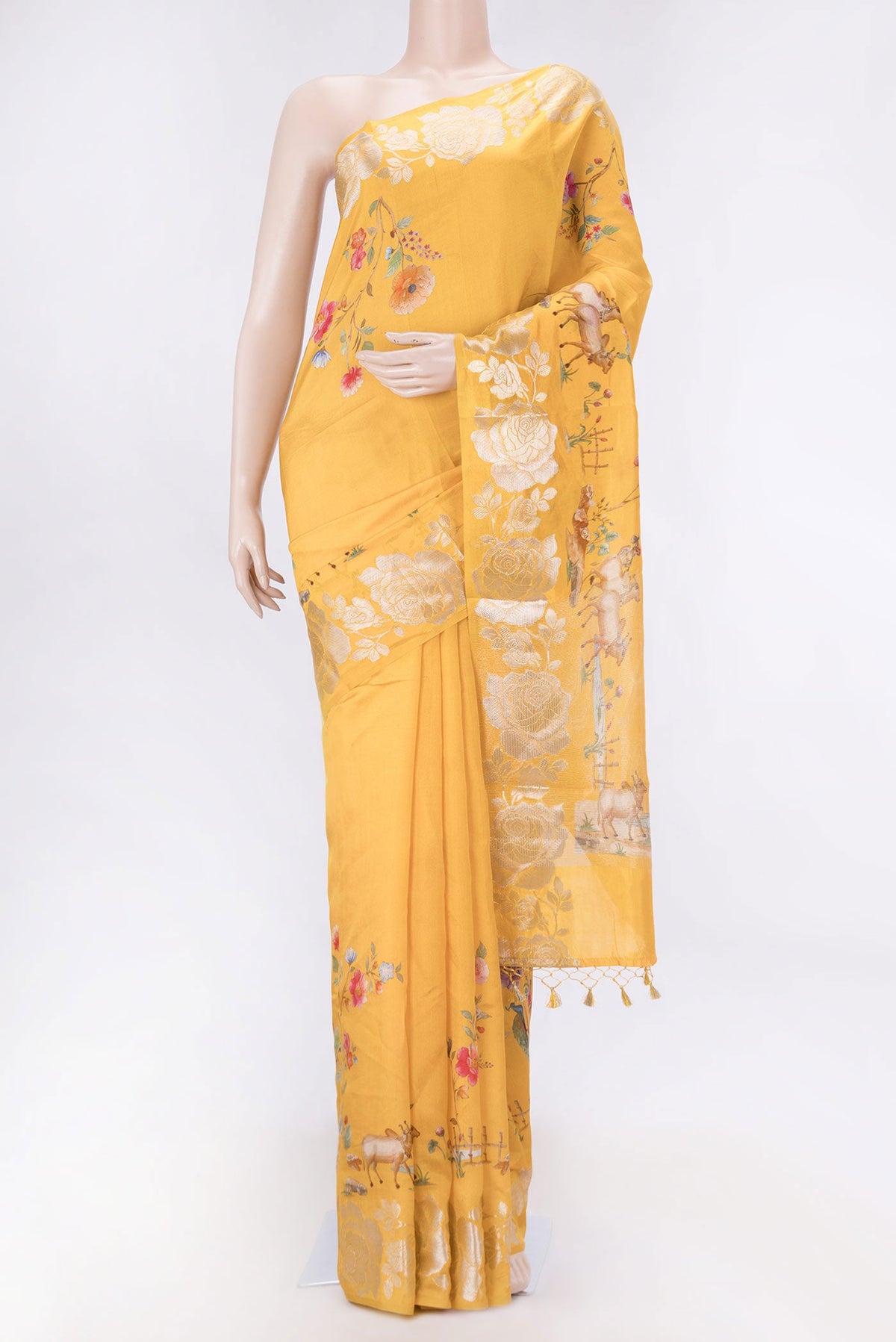 Orange Dual Tone Tussar Silk SareePrinted design on the body and Zari Border displayed on a mannequin