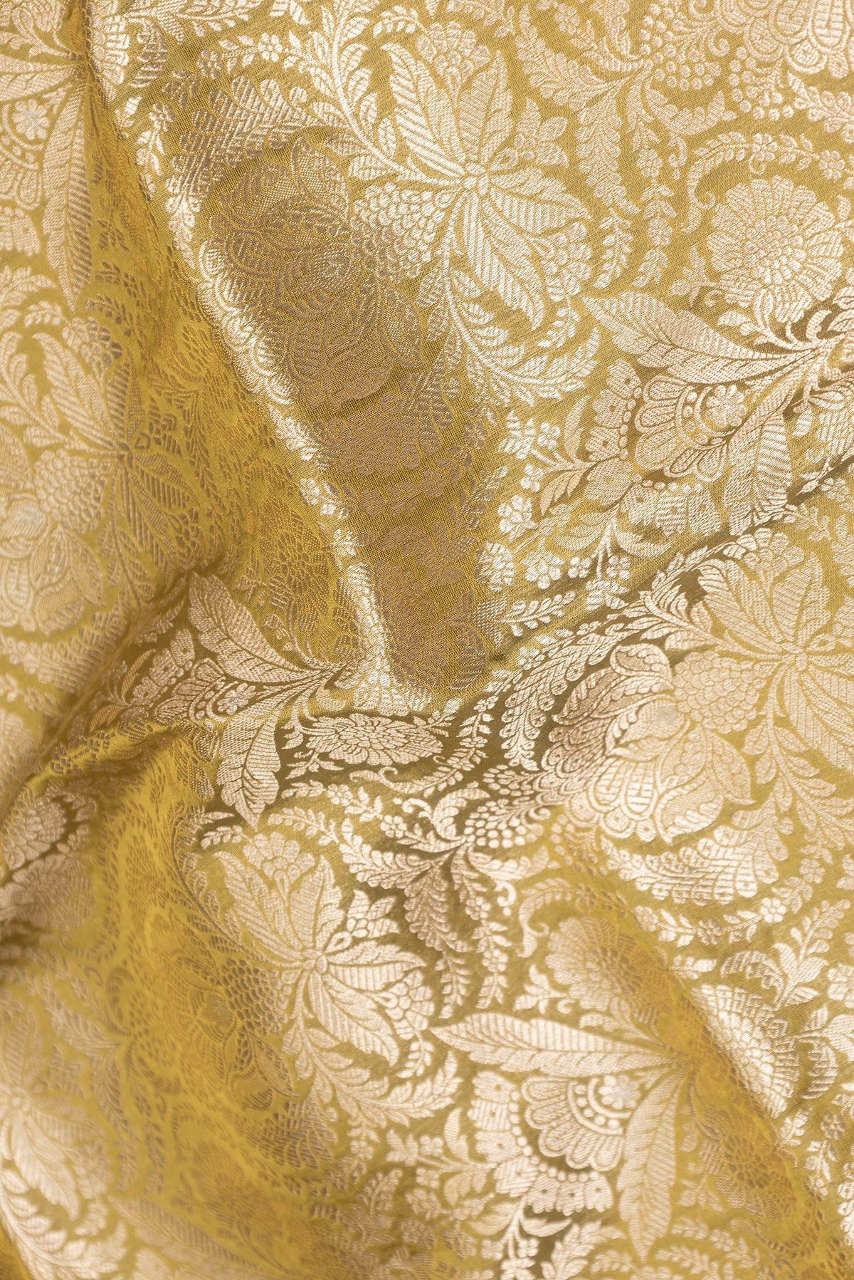 Close up of Mehandi Green Dual Tone Banarasi Silk Saree with Zari Brocade on the body and Zari Border.  displaying folds