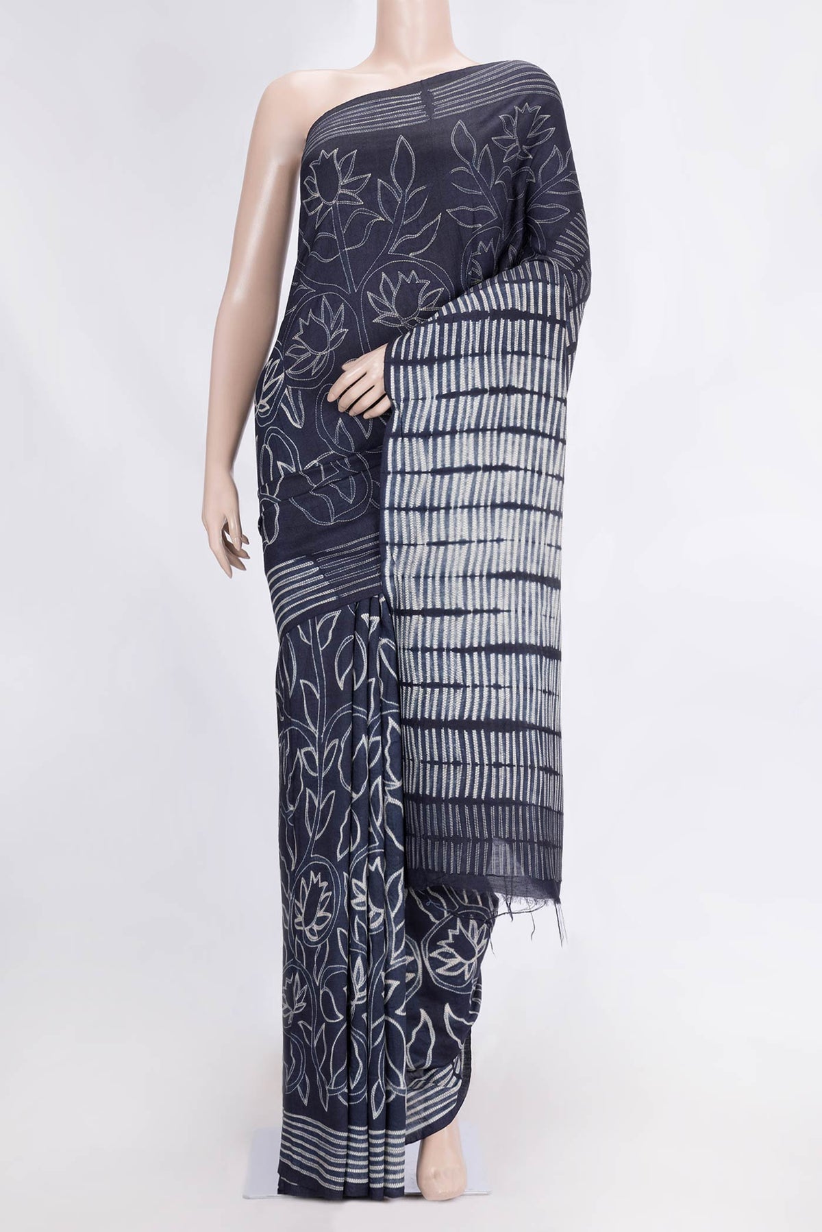 Navy Blue Dual Tone Tussar Saree with Printed design on the body and Printed Border.  displayed on a mannequin