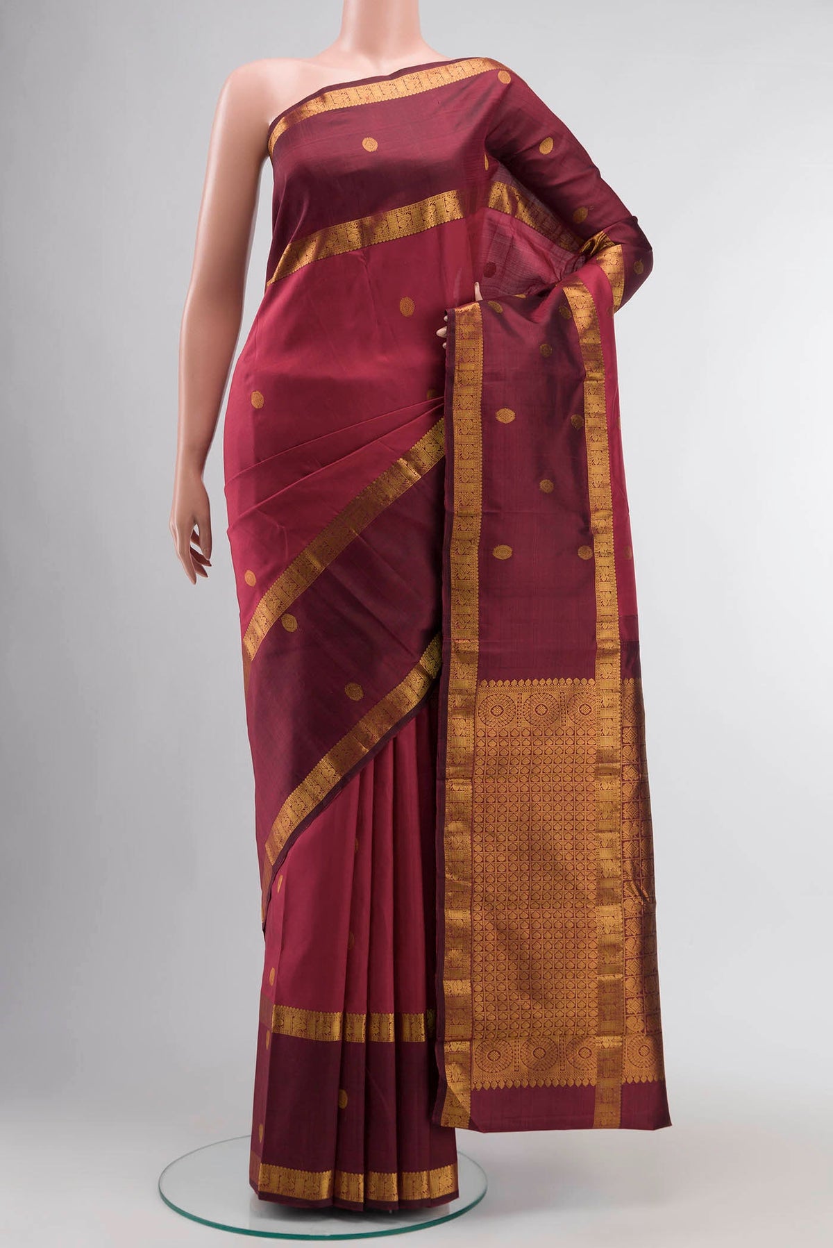 Pink Kanchipuram Silk Saree with Zari Butta on the body and Zari Border displayed on a mannequin