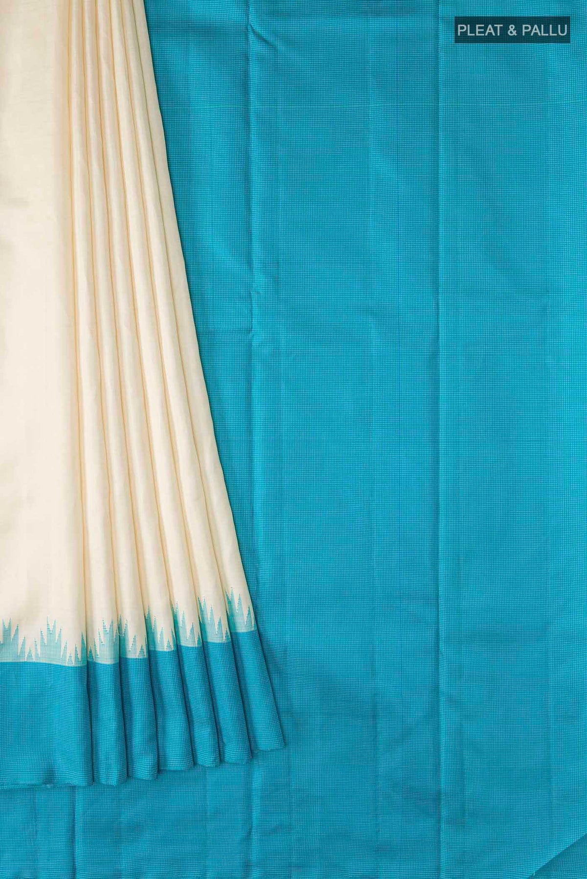 Pleats and pallu of Cream Kanchipuram Silk Saree with Plain Body and Temple Border