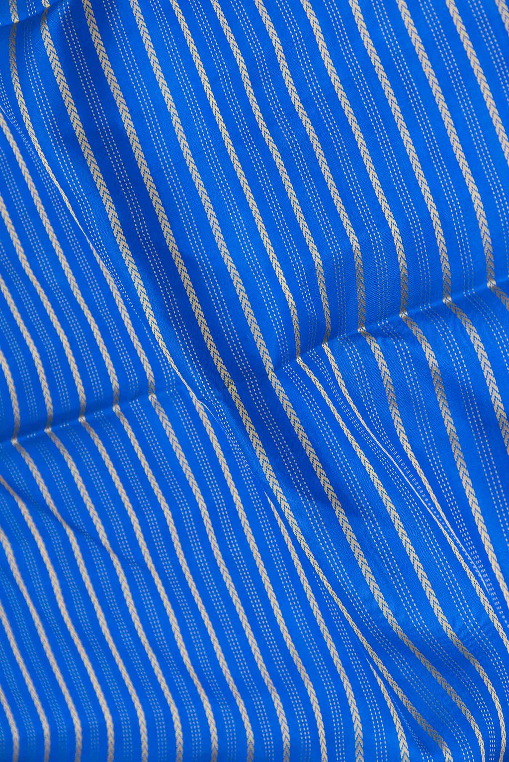 Close up of Pure Silk Pure Zari Royal Blue Dual Tone Kanchipuram Saree with Stripes on the body and Zari Border displaying folds