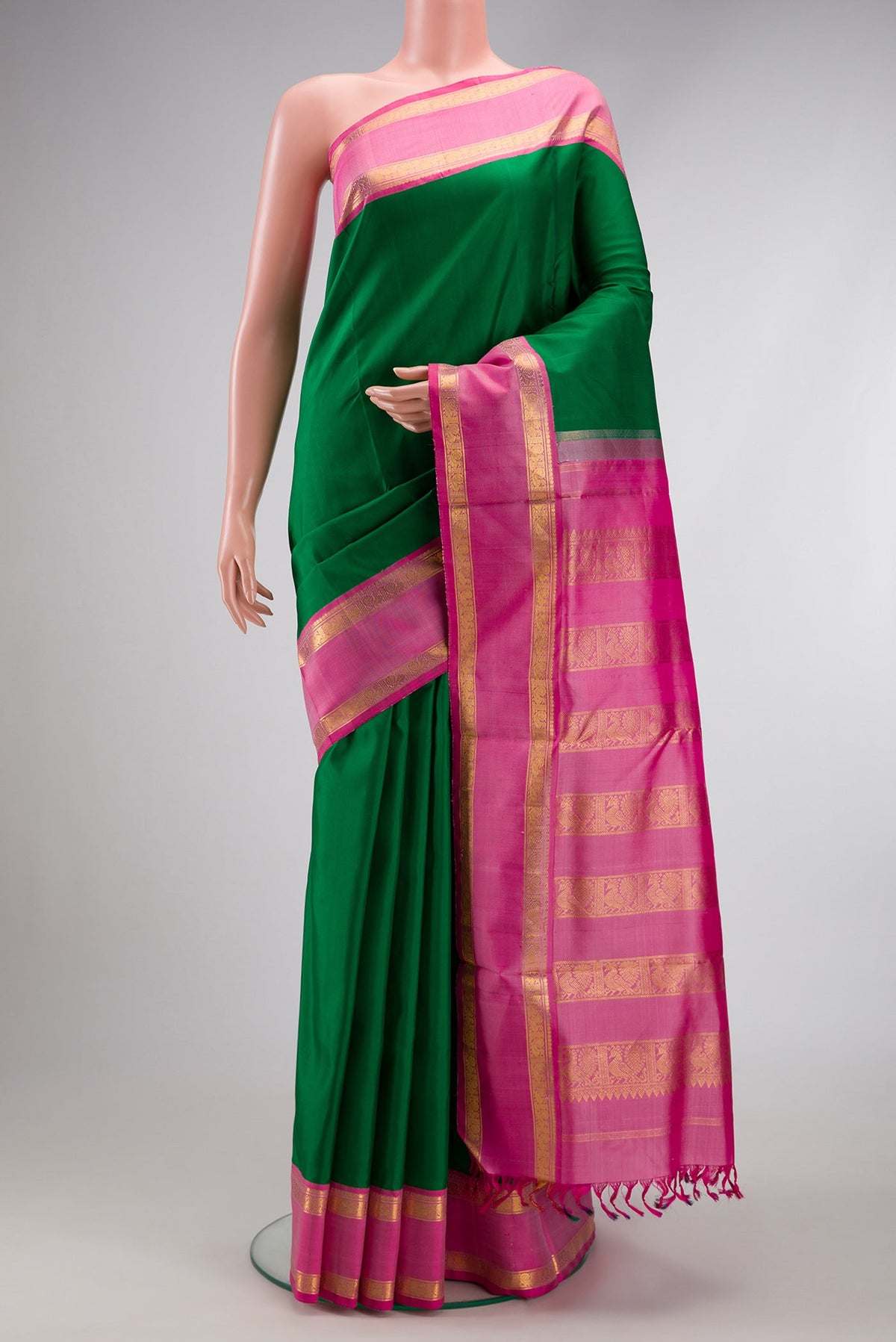 Pure Silk Pure Zari Bottle Green Dual Tone Kanchipuram Nine Yards Saree with Plain Body and Zari Border.  displayed on a mannequin