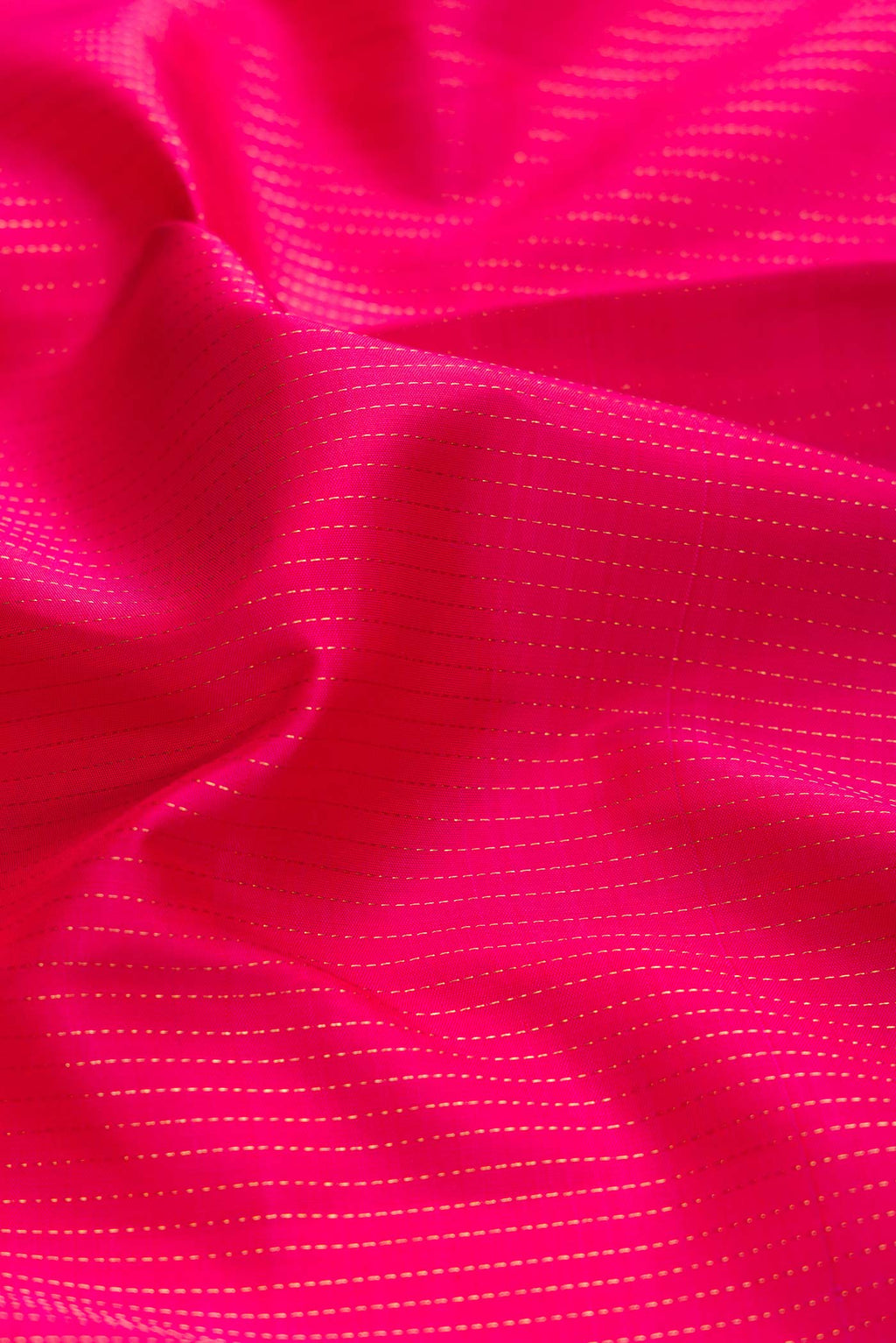 Close up of Dark Pink Dual Tone Kanchipuram Silk Saree with Stripes on the body and Zari Border displaying folds