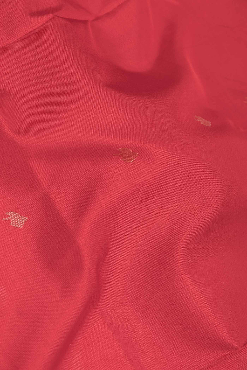 Close up of Red Dual Tone Uppada Silk Saree with Zari And Thread Butta on the body and Zari Border displaying folds
