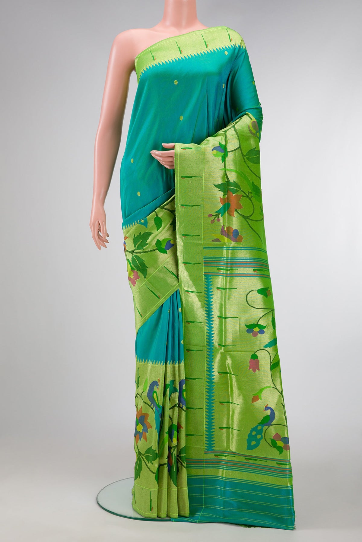 Peacock Blue Dual Tone Paithani Silk Saree with Zari Butta on the body and Paithani Border.  displayed on a mannequin